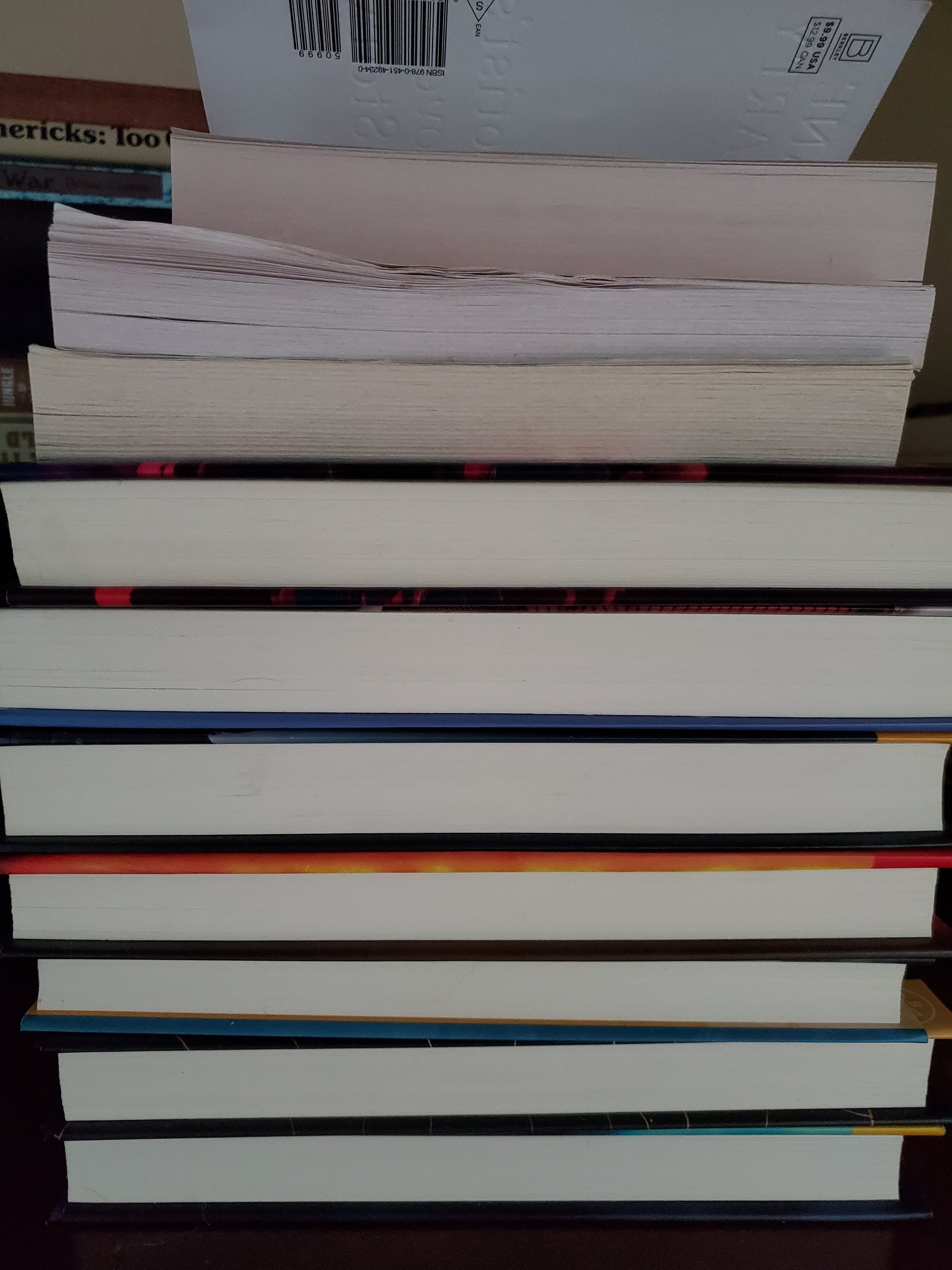 Stacked books with pages facing the viewer.