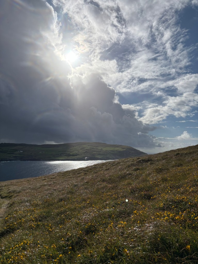 Brilliant sunshine on the edge of dark clouds